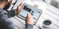 Man Browsing on Tablet